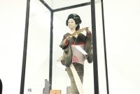 A Japanese Doll In Glass Display Cabinet in sizing 3024 X 4032