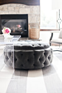 Round Upholstered Tufted Ottoman Tucked Under Acrylic Coffee Table pertaining to sizing 2500 X 3750