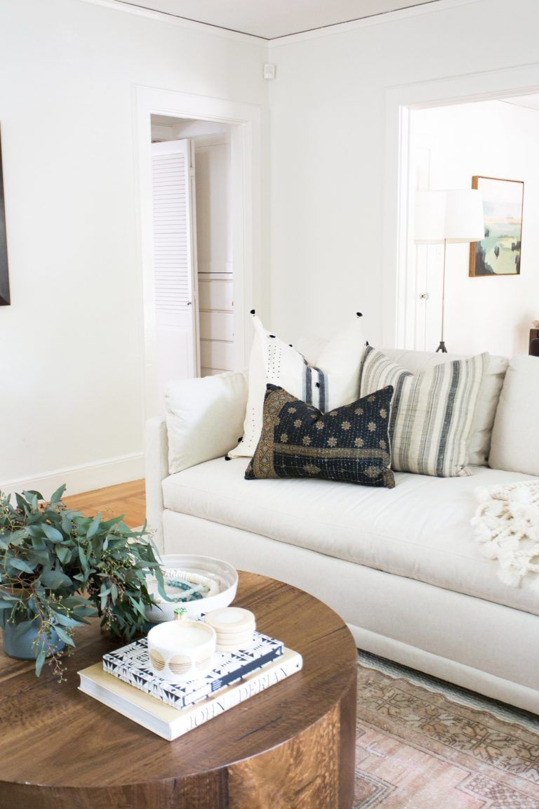 White Couch In A Boho Styled Living Room With A Round Wood Coffee inside proportions 768 X 1152
