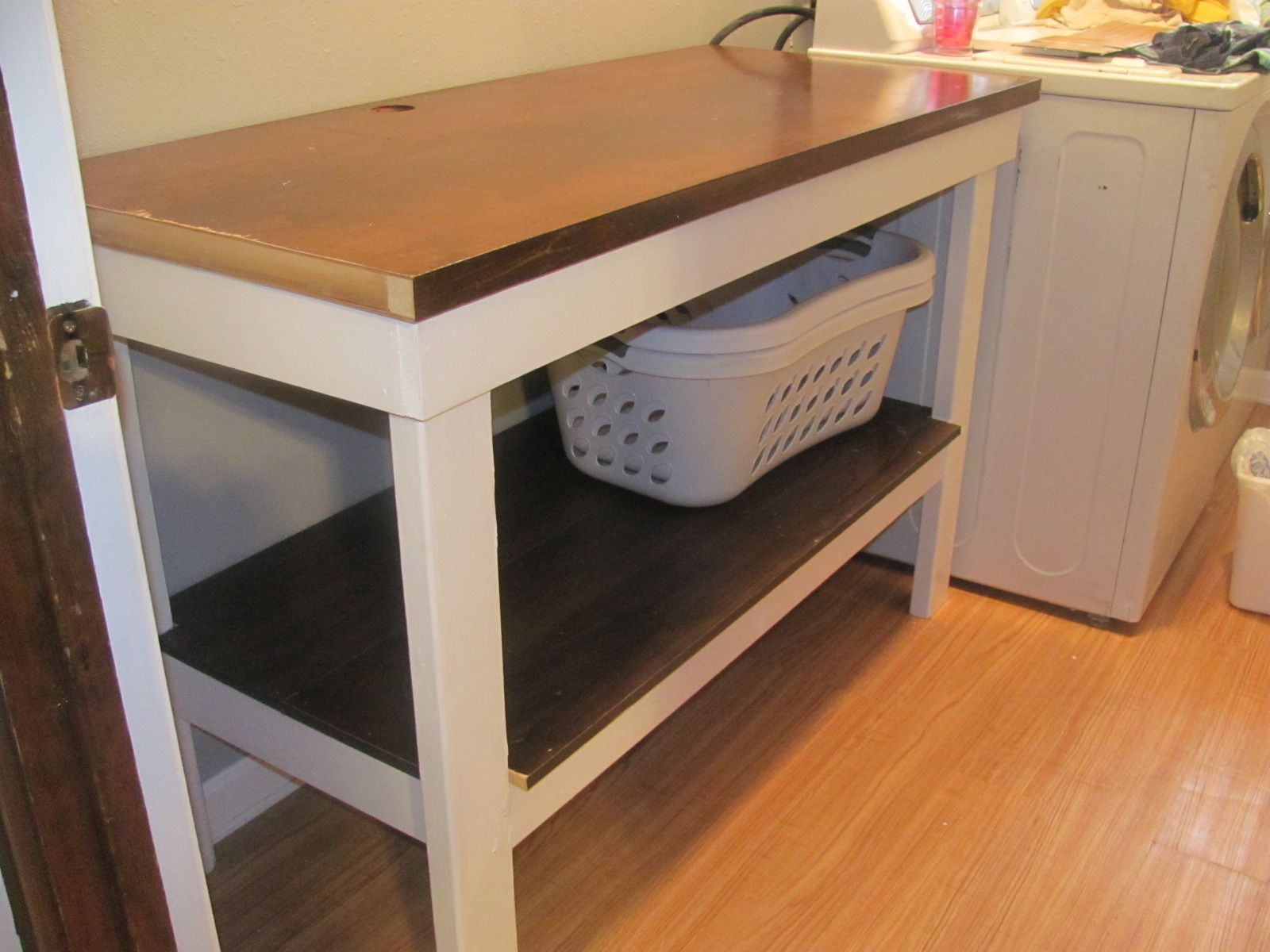 laundry room table with storage